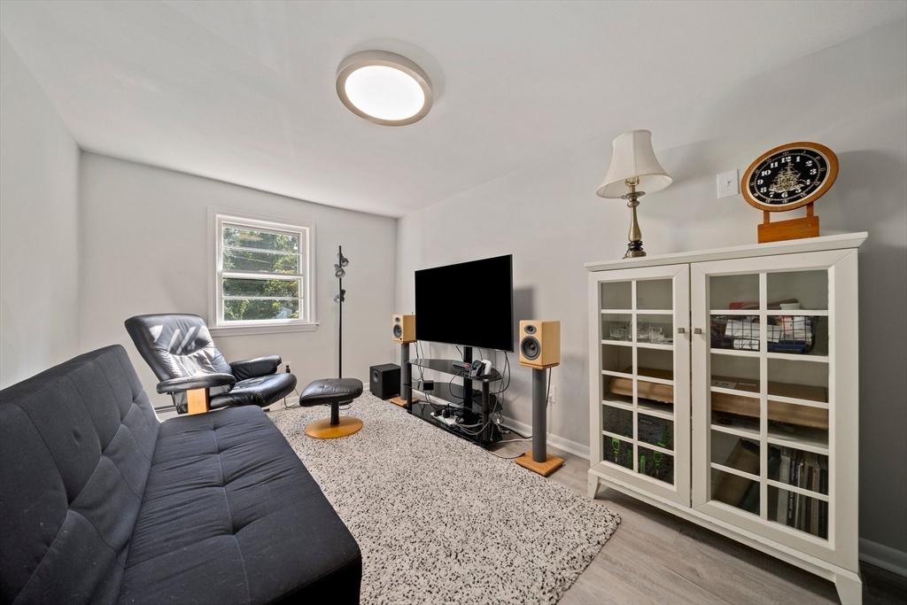 86 High Street Randolph, MA 02368 - Photo 8 of 28 a living room with furniture and a flat screen tv
