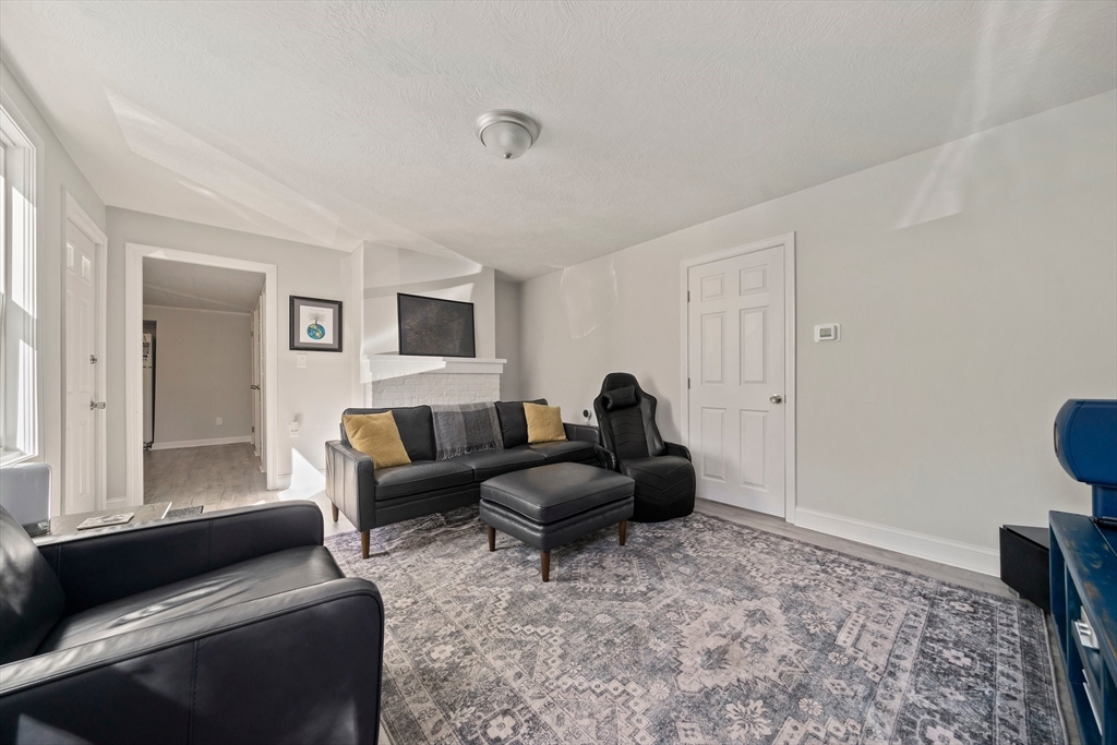 86 High Street Randolph, MA 02368 - Photo 9 of 28 a living room with furniture and a window
