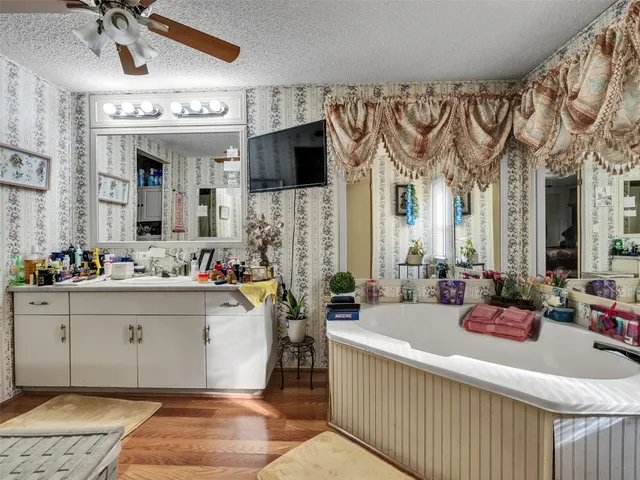 a kitchen with stainless steel appliances a refrigerator sink and cabinets