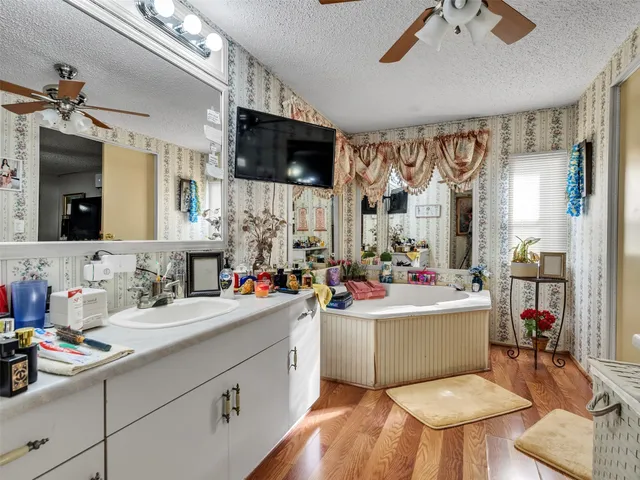 a utility room with dryer washer and a view of living area
