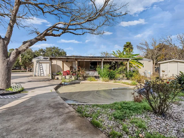 en empty room with window and wooden floor
