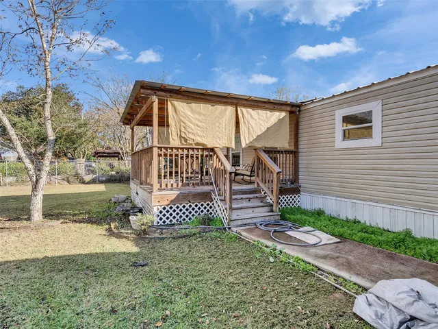 a white bath tub sitting next to a white toilet and a shower