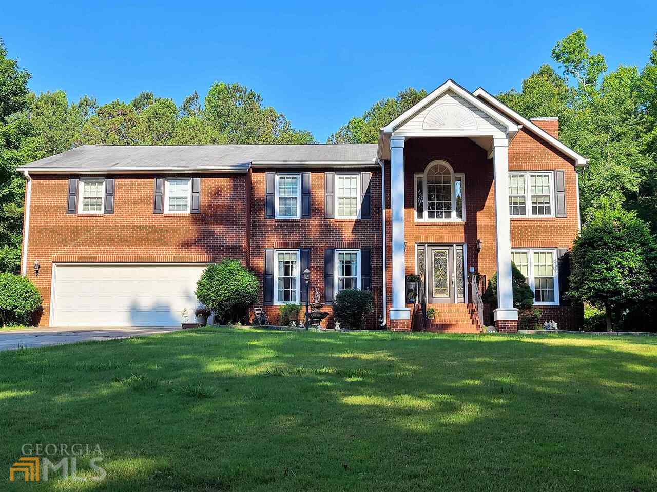 340 Pleasant Ridge Road Carrollton, GA 30117 - Photo 1 of 1 a front view of a house with a yard