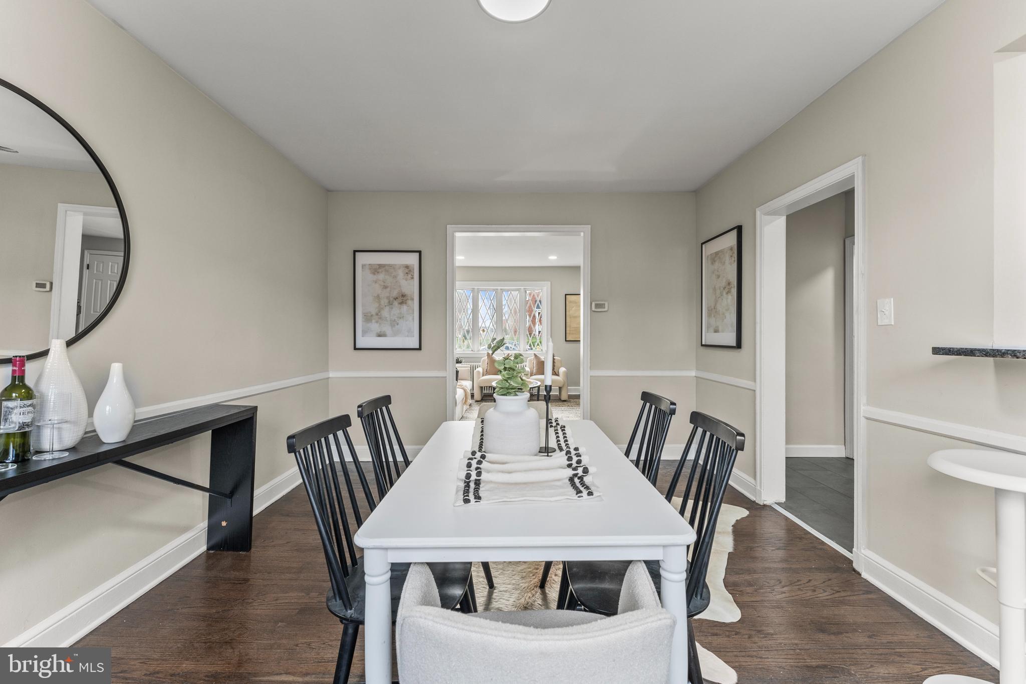 1324 Crofton Road Baltimore, MD 21239 - Photo 12 of 24 a view of a dining room with furniture and wooden floor