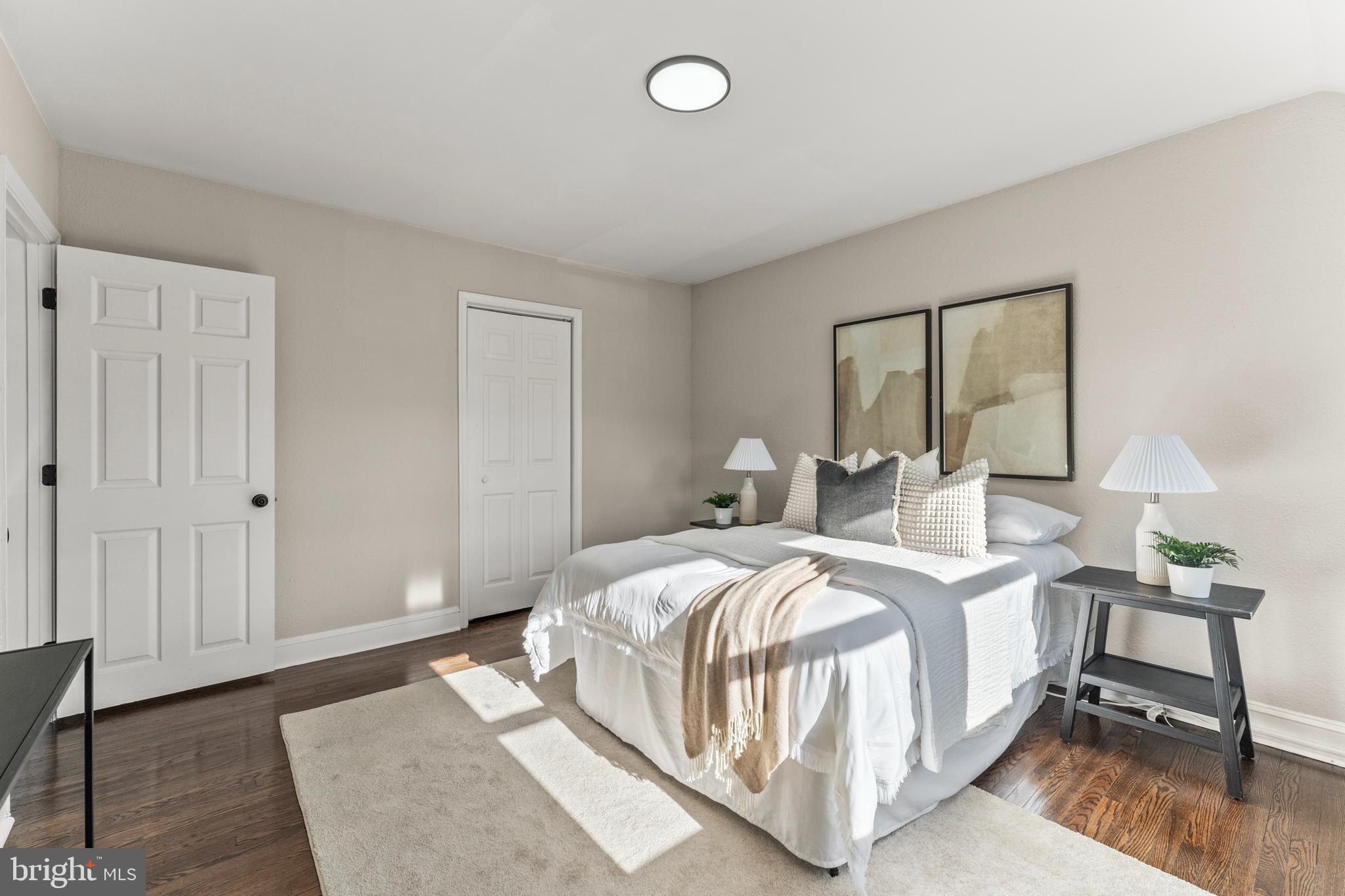 1324 Crofton Road Baltimore, MD 21239 - Photo 13 of 24 a bedroom with a bed and a table