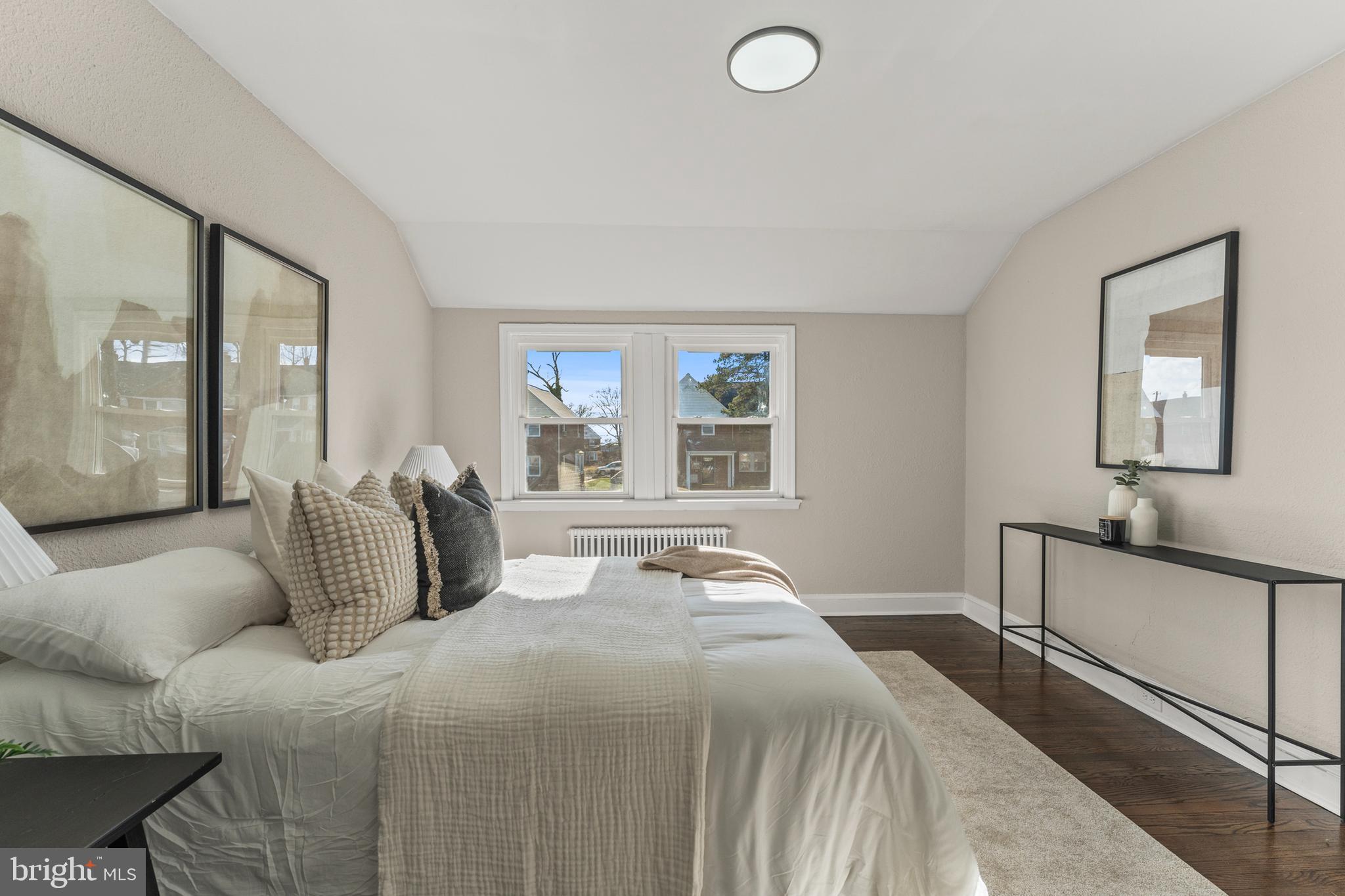 1324 Crofton Road Baltimore, MD 21239 - Photo 14 of 24 a bedroom with a large bed and a window