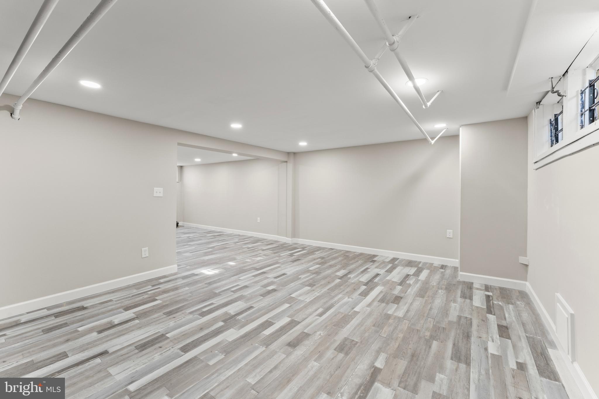 1324 Crofton Road Baltimore, MD 21239 - Photo 21 of 24 a view of an empty room with wooden floor