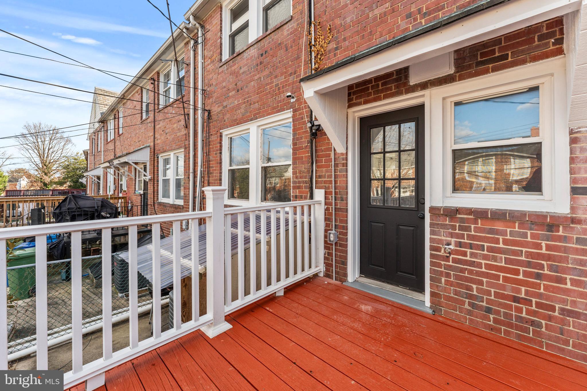 1324 Crofton Road Baltimore, MD 21239 - Photo 24 of 24 a view of a brick house with wooden floor and fence