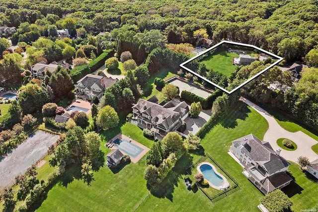 an aerial view of residential house with outdoor space and swimming pool