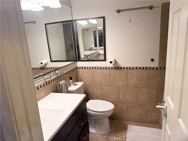 a bathroom with a double vanity sink and mirror