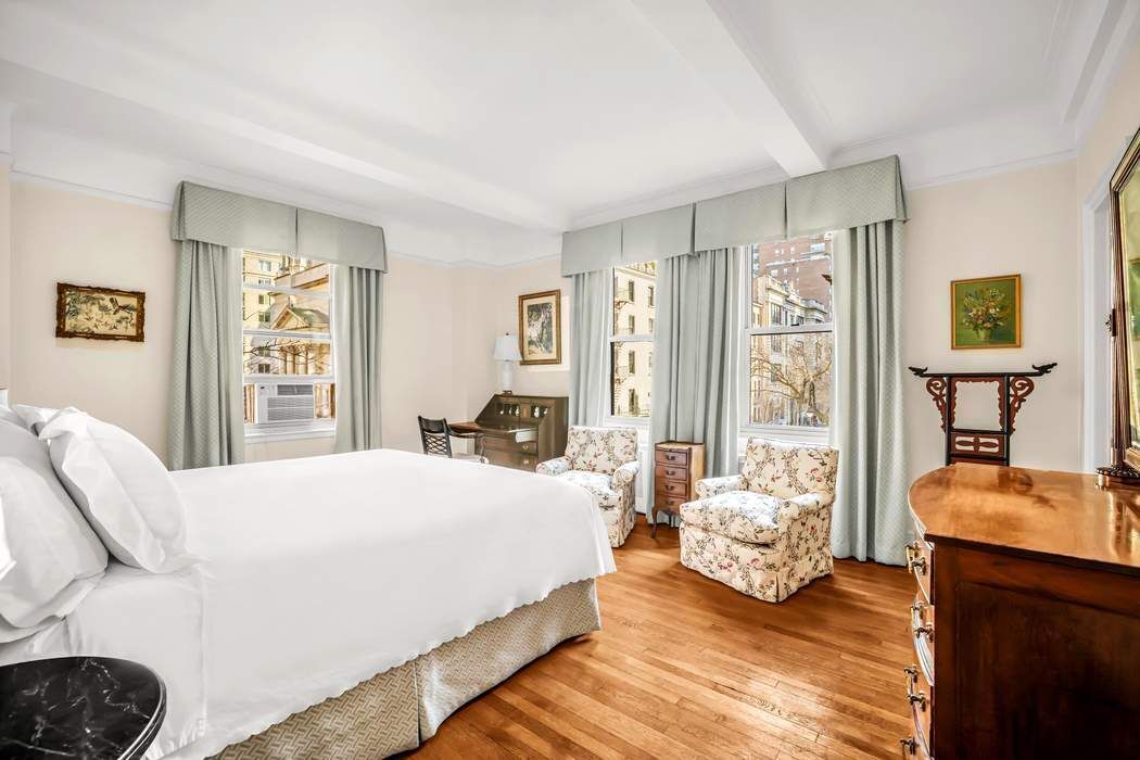 130 East 75th Street, Unit 3B Manhattan, NY 10021 - Photo 10 of 15 a bedroom with a bed and wooden floor
