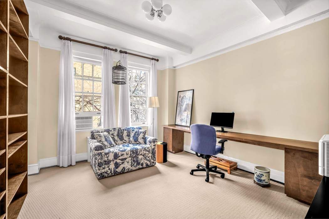 130 East 75th Street, Unit 3B Manhattan, NY 10021 - Photo 11 of 15 a workspace with furniture and a window