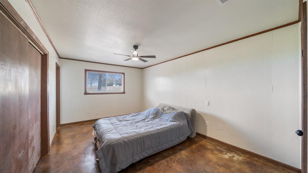 1123 Tbd County Road Fruitvale, TX 75127 - Photo 15 of 31 a bedroom with a bed and a painting on the wall