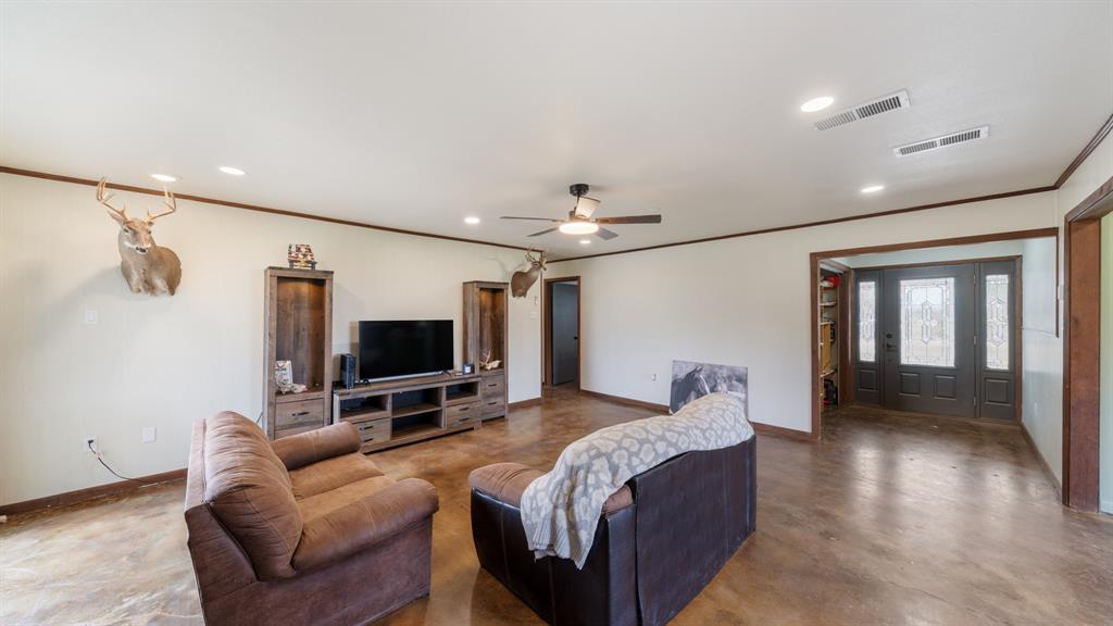1123 Tbd County Road Fruitvale, TX 75127 - Photo 7 of 31 a spacious bedroom with a bed and a flat screen tv