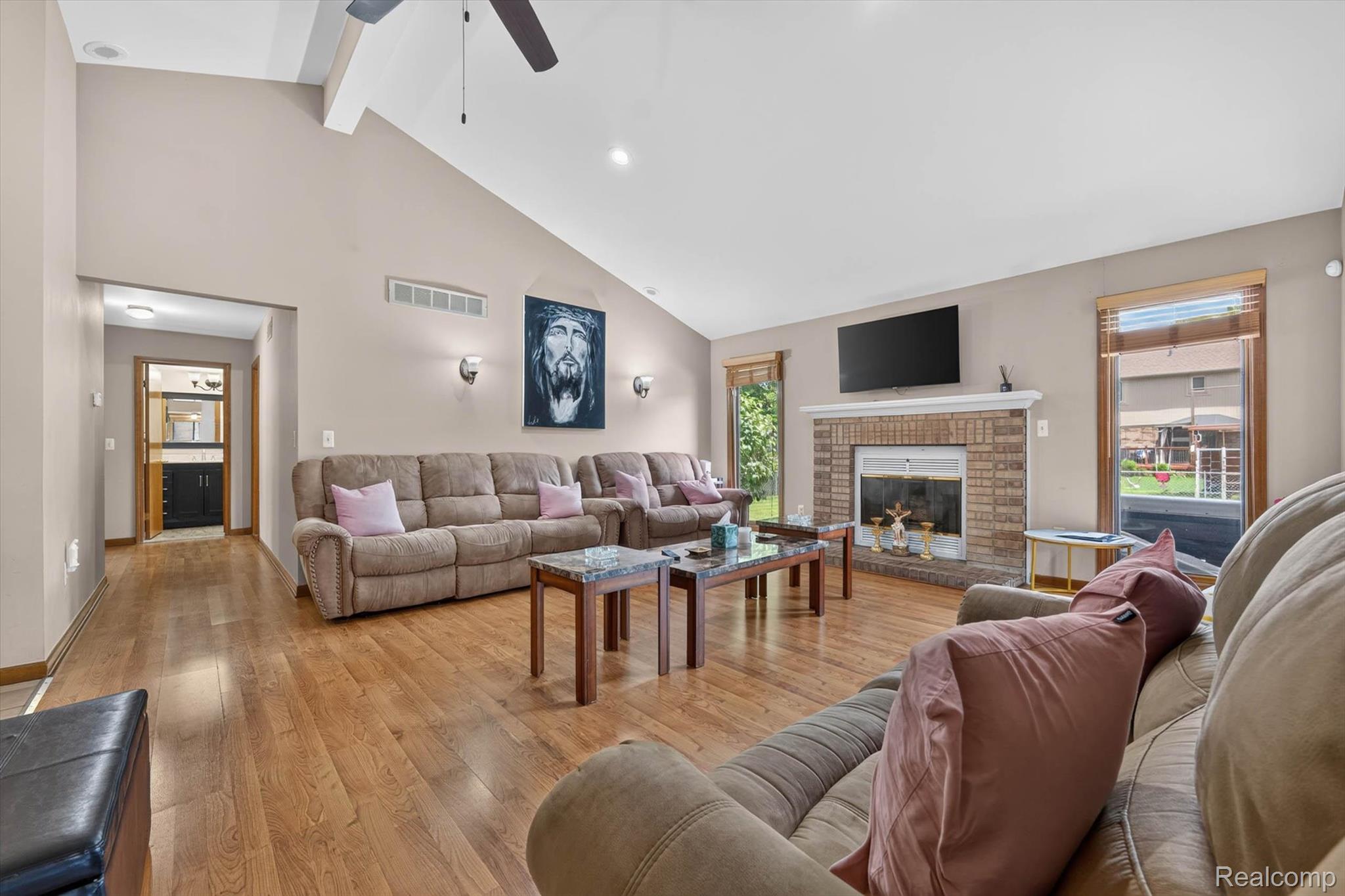 46362 Springhill Drive Utica, MI 48317 - Photo 7 of 59 Spacious living area featuring vaulted ceilings, wood-finish flooring, recessed lighting, and a ceiling fan