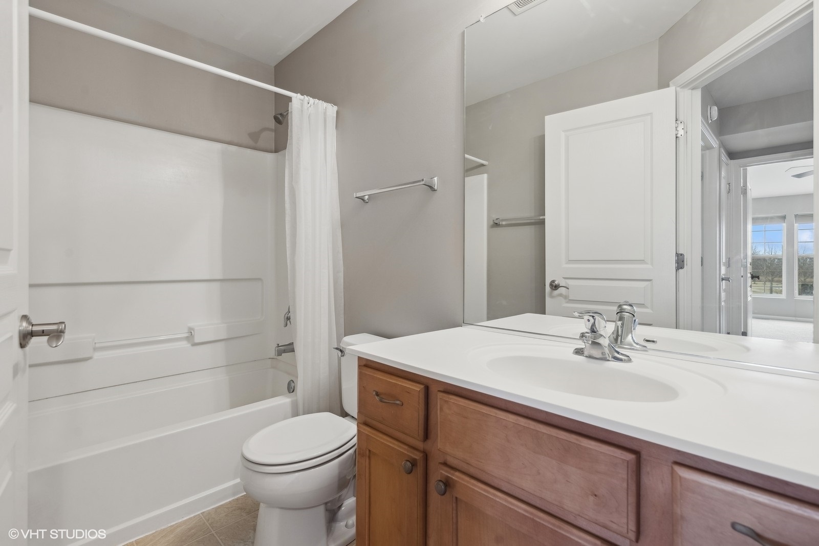 16808 Locust Lane Lockport, IL 60441 - Photo 17 of 20 a bathroom with a sink toilet and shower