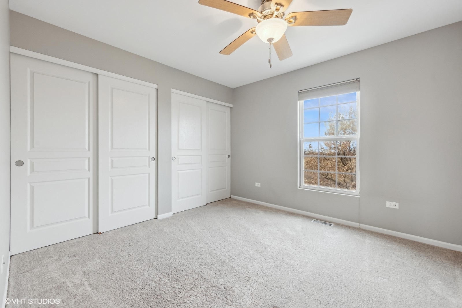 16808 Locust Lane Lockport, IL 60441 - Photo 18 of 20 an empty room with windows and fan