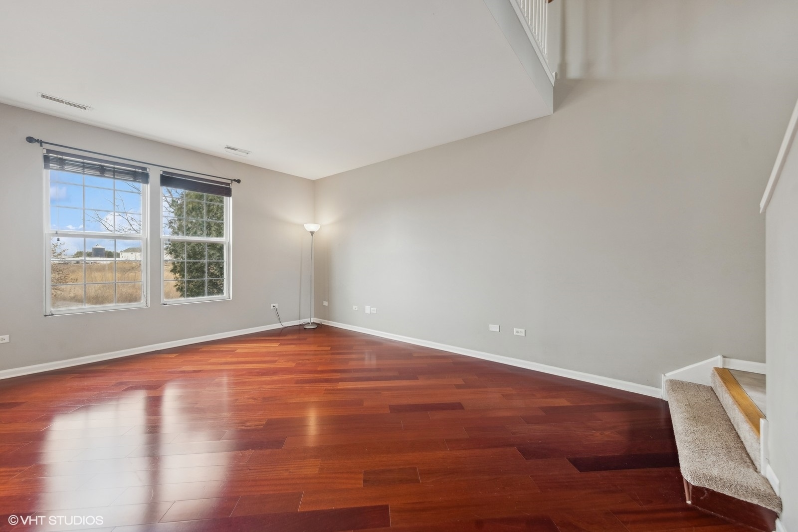 16808 Locust Lane Lockport, IL 60441 - Photo 4 of 20 a view of an empty room with wooden floor and a window