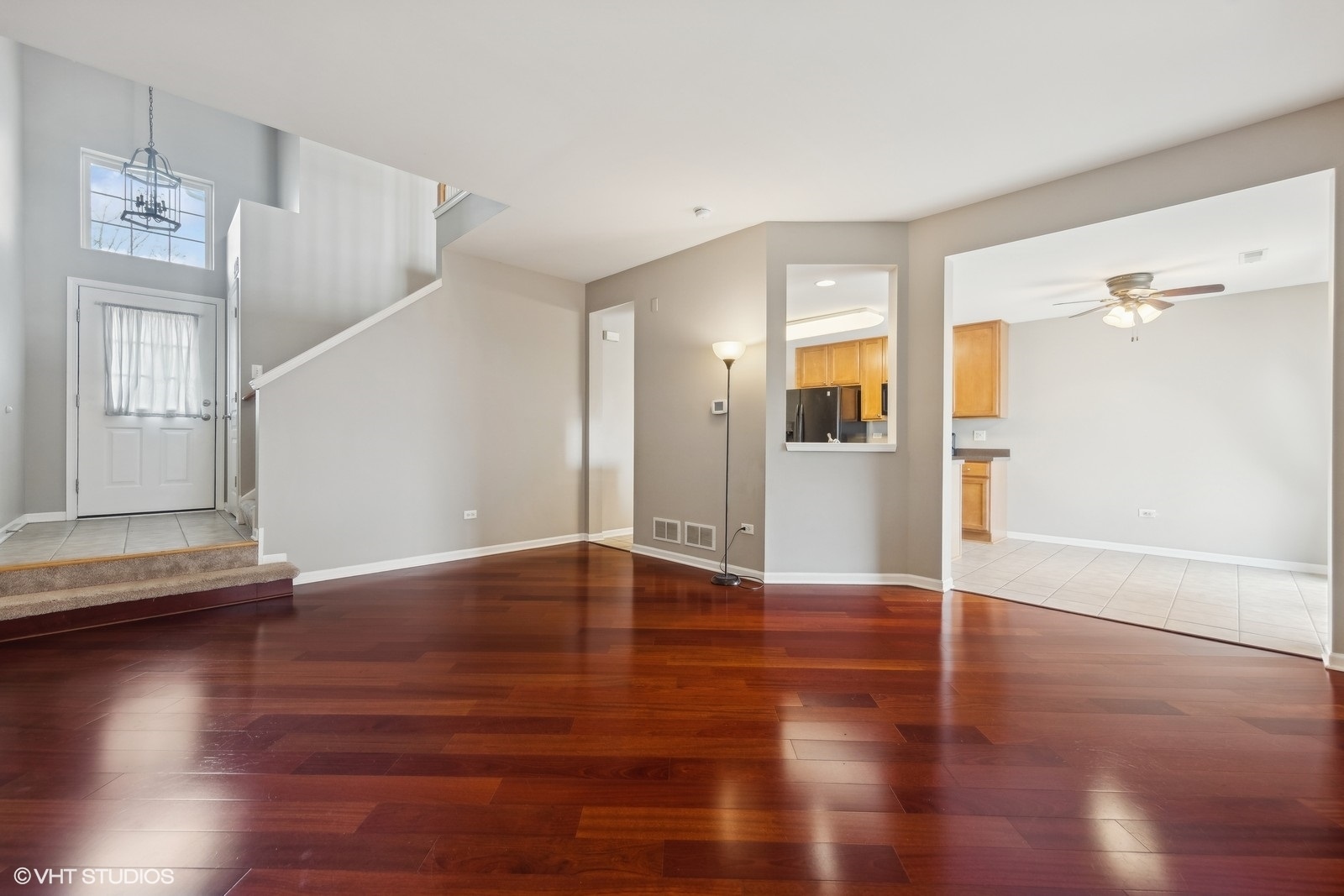 16808 Locust Lane Lockport, IL 60441 - Photo 5 of 20 a view of an empty room with wooden floor and a window