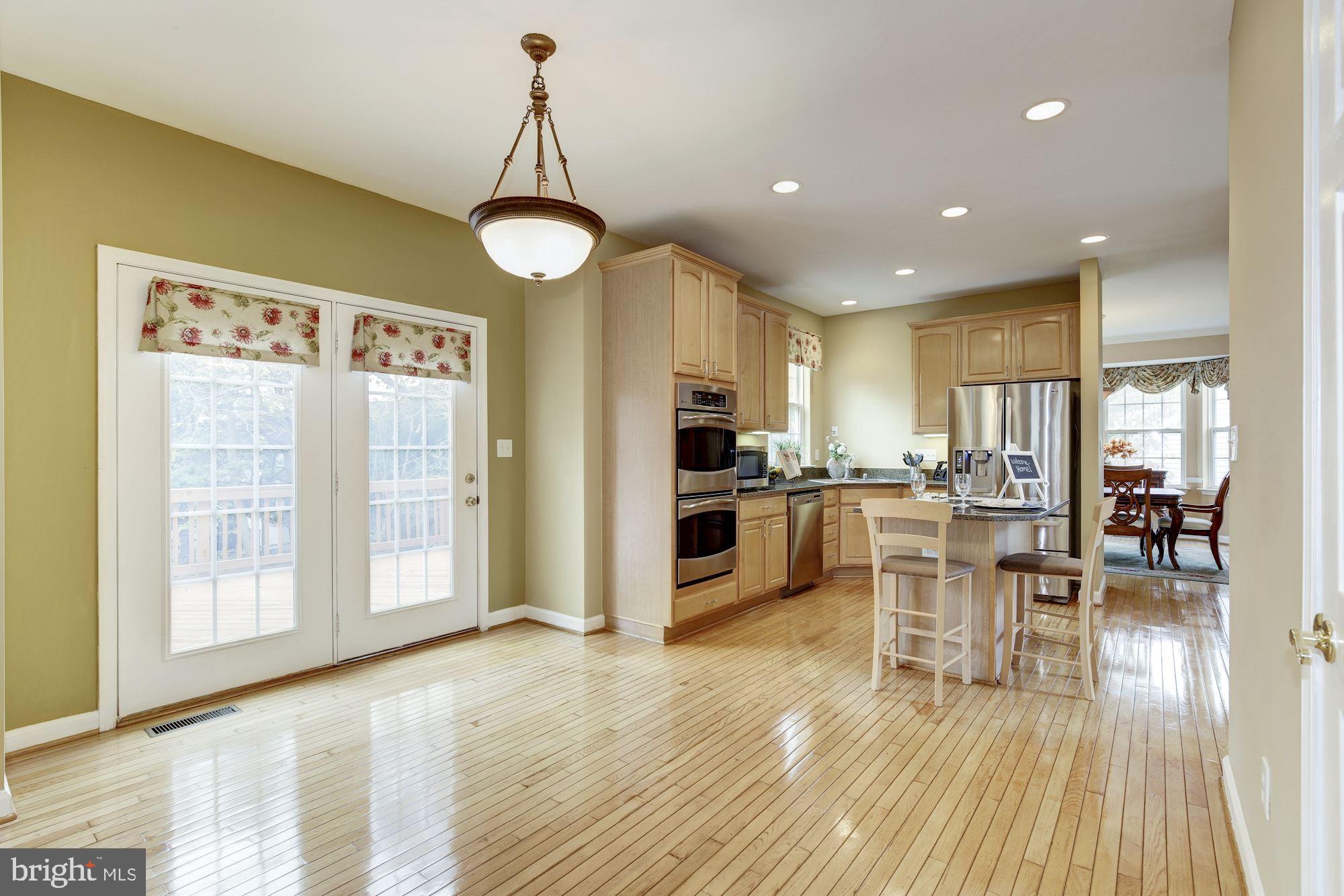18815 Severn Road Gaithersburg, MD 20879 - Photo 15 of 38 Sliding glass door opens to the wood deck