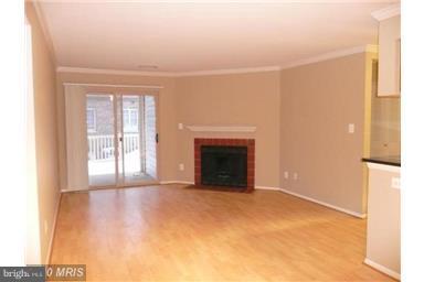 1711 B Ascot Way, Unit B Reston, VA 20190 - Photo 4 of 13 Living Room walk out to patio
