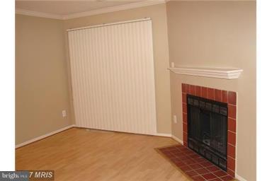 1711 B Ascot Way, Unit B Reston, VA 20190 - Photo 7 of 13 Interior (General) wood fireplace