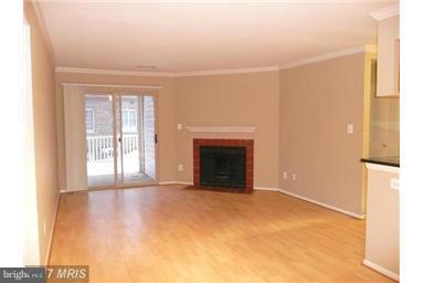 1711 B Ascot Way, Unit B Reston, VA 20190 - Photo 8 of 13 Living Room with wood fireplace for cozy winter ti