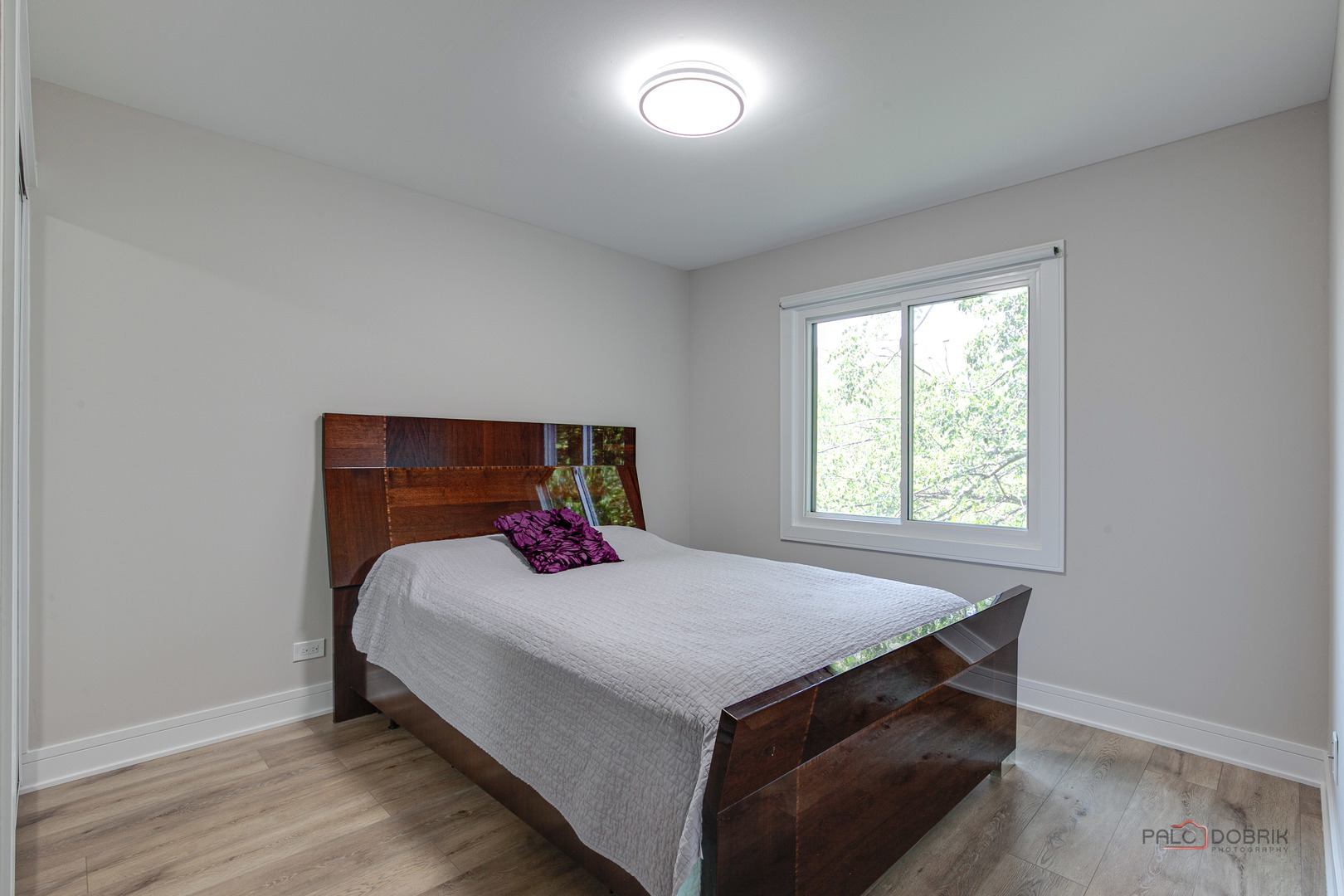 5190 Chambers Drive Hoffman Estates, IL 60010 - Photo 18 of 23 a bedroom with a bed and a window