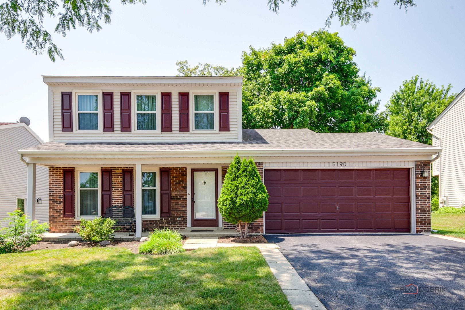 5190 Chambers Drive Hoffman Estates, IL 60010 - Photo 2 of 23 a front view of a house with yard and porch