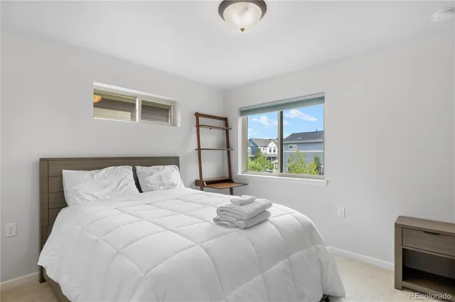 a bedroom with a bed and a night lamp