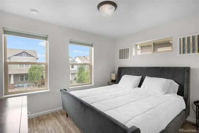 a bedroom with a bed and a night stand