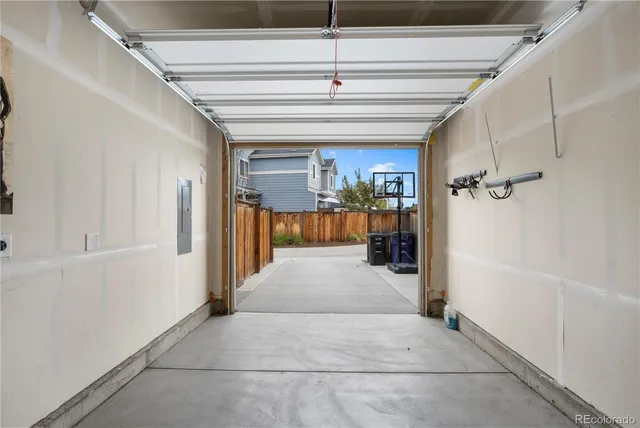 a balcony with table and chairs