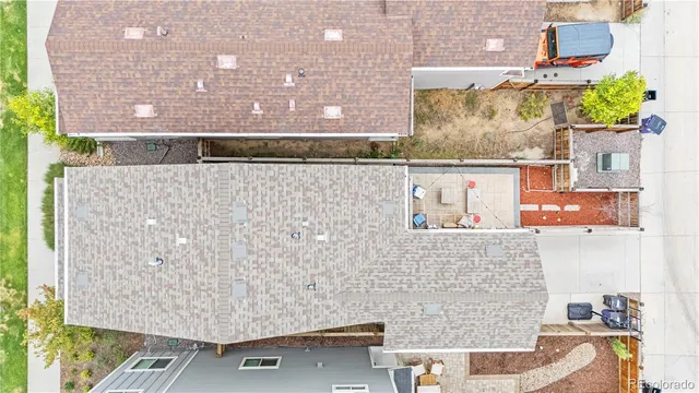 a view of a house with wooden deck and furniture