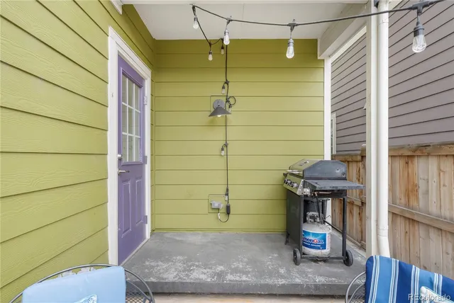 a backyard of a house with outdoor seating