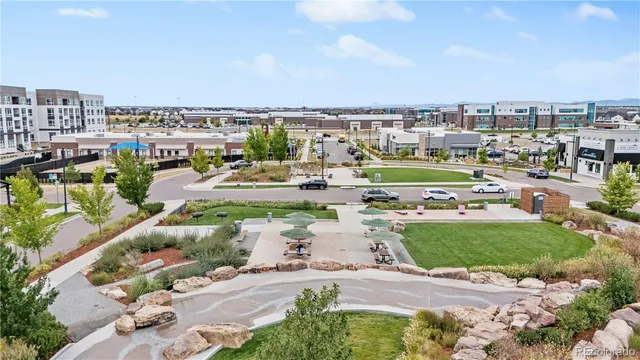 an aerial view of a building with an outdoor space