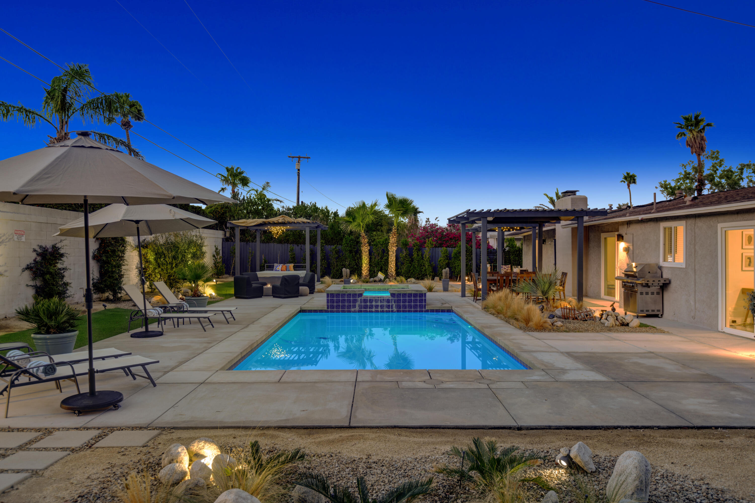 3059 North Biskra Road Palm Springs, CA 92262 - Photo 1 of 44 a view of a house with swimming pool and sitting area
