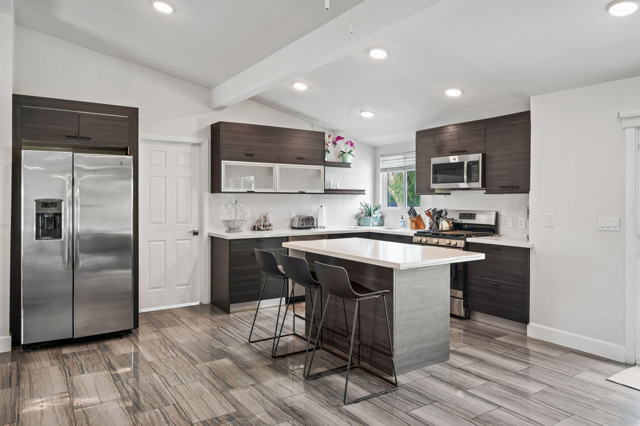 3059 North Biskra Road Palm Springs, CA 92262 - Photo 11 of 44 a kitchen with a sink stainless steel appliances and counter space