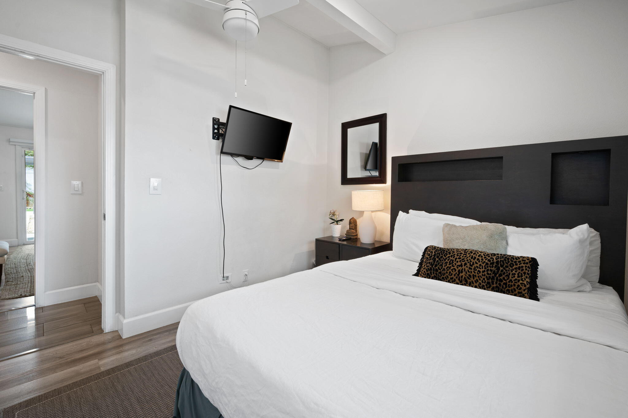 3059 North Biskra Road Palm Springs, CA 92262 - Photo 17 of 44 a bedroom with a bed and wooden floor