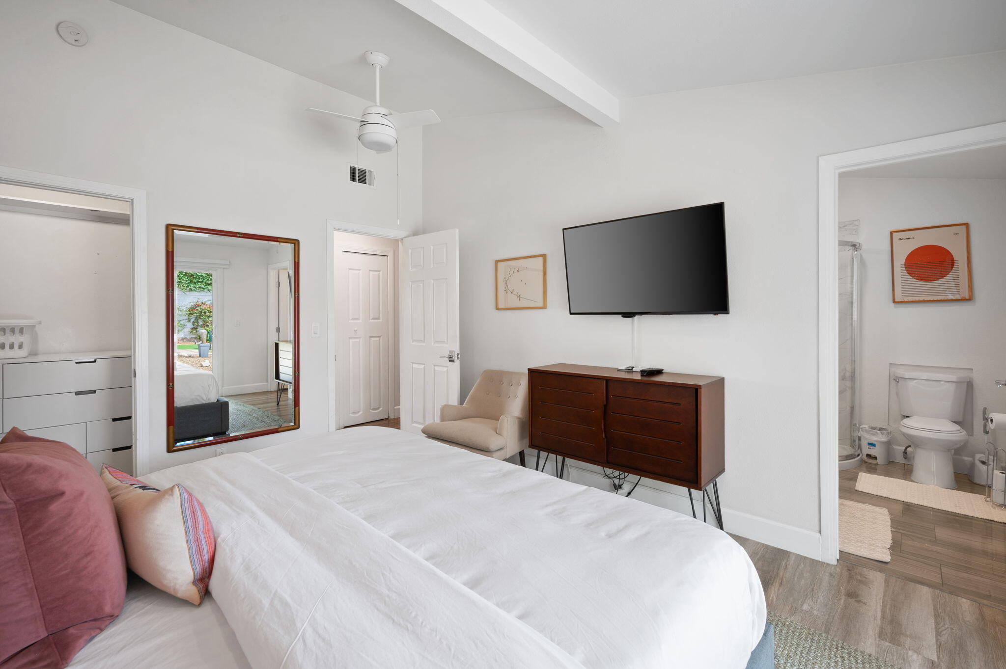 3059 North Biskra Road Palm Springs, CA 92262 - Photo 22 of 44 a bedroom with a bed and a flat screen tv
