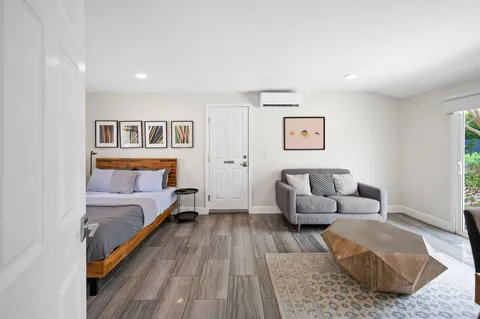 a bed room with furniture and a couch