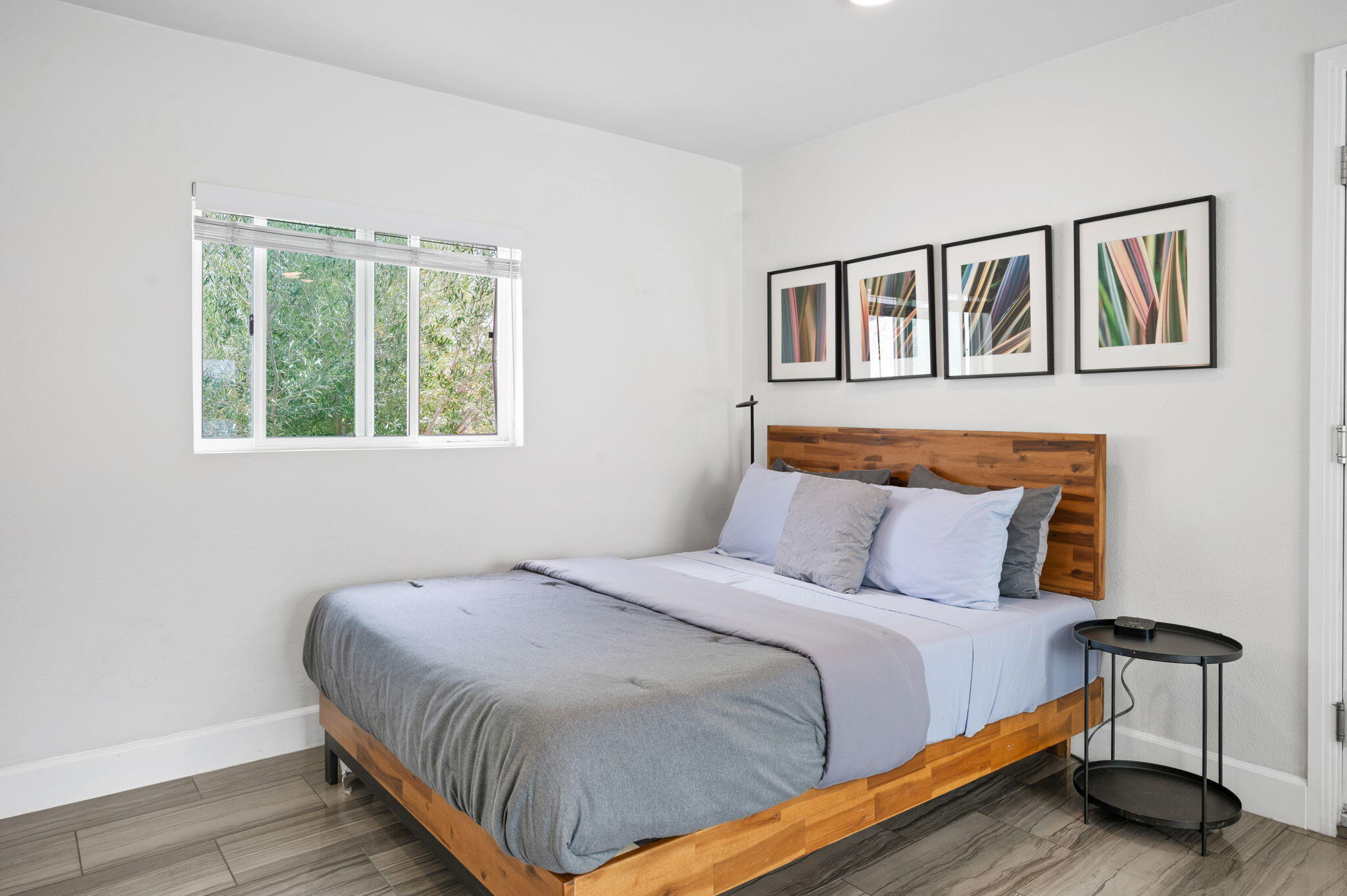 3059 North Biskra Road Palm Springs, CA 92262 - Photo 26 of 44 a bedroom with a bed and wooden floor