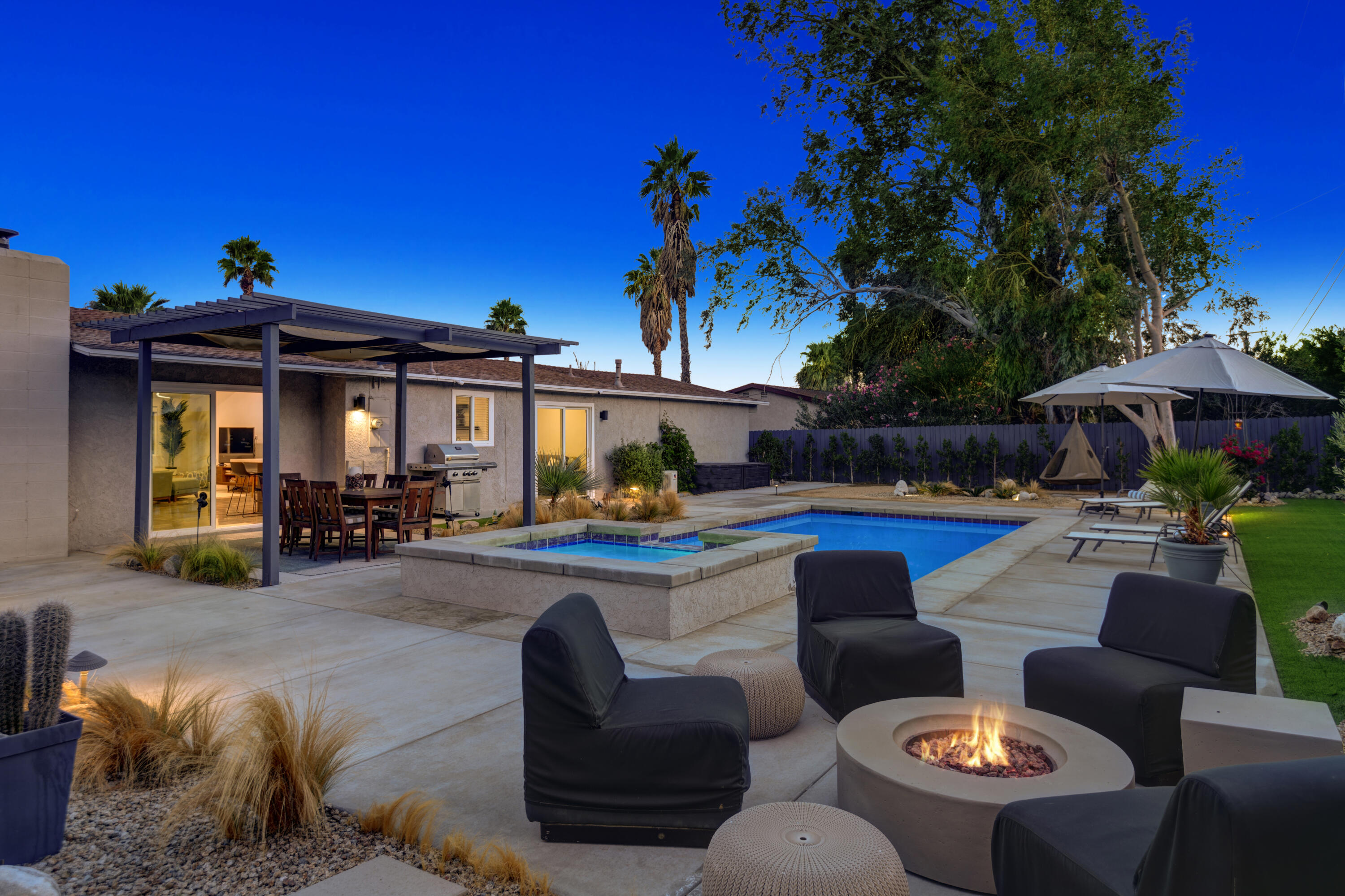 3059 North Biskra Road Palm Springs, CA 92262 - Photo 32 of 44 a view of a patio with couches chairs and potted plants