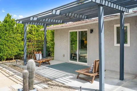 a view of a patio with a table and chairs in patio