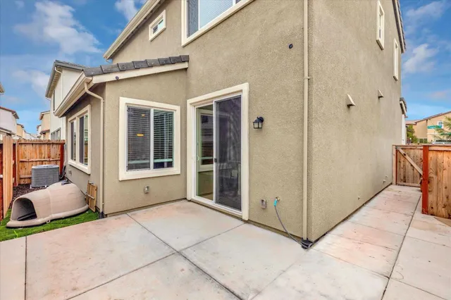 a view of a brick house with many windows