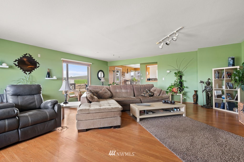 740 Gap Road Granger, WA 98932 - Photo 17 of 40 a living room with furniture and wooden floor