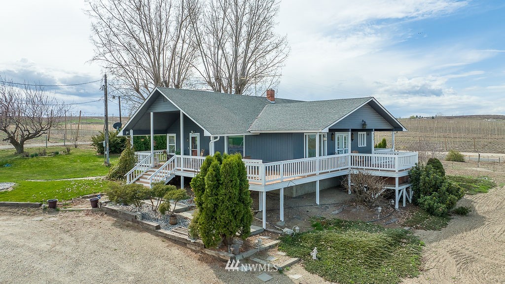 740 Gap Road Granger, WA 98932 - Photo 2 of 40 a view of house with a yard and potted plants