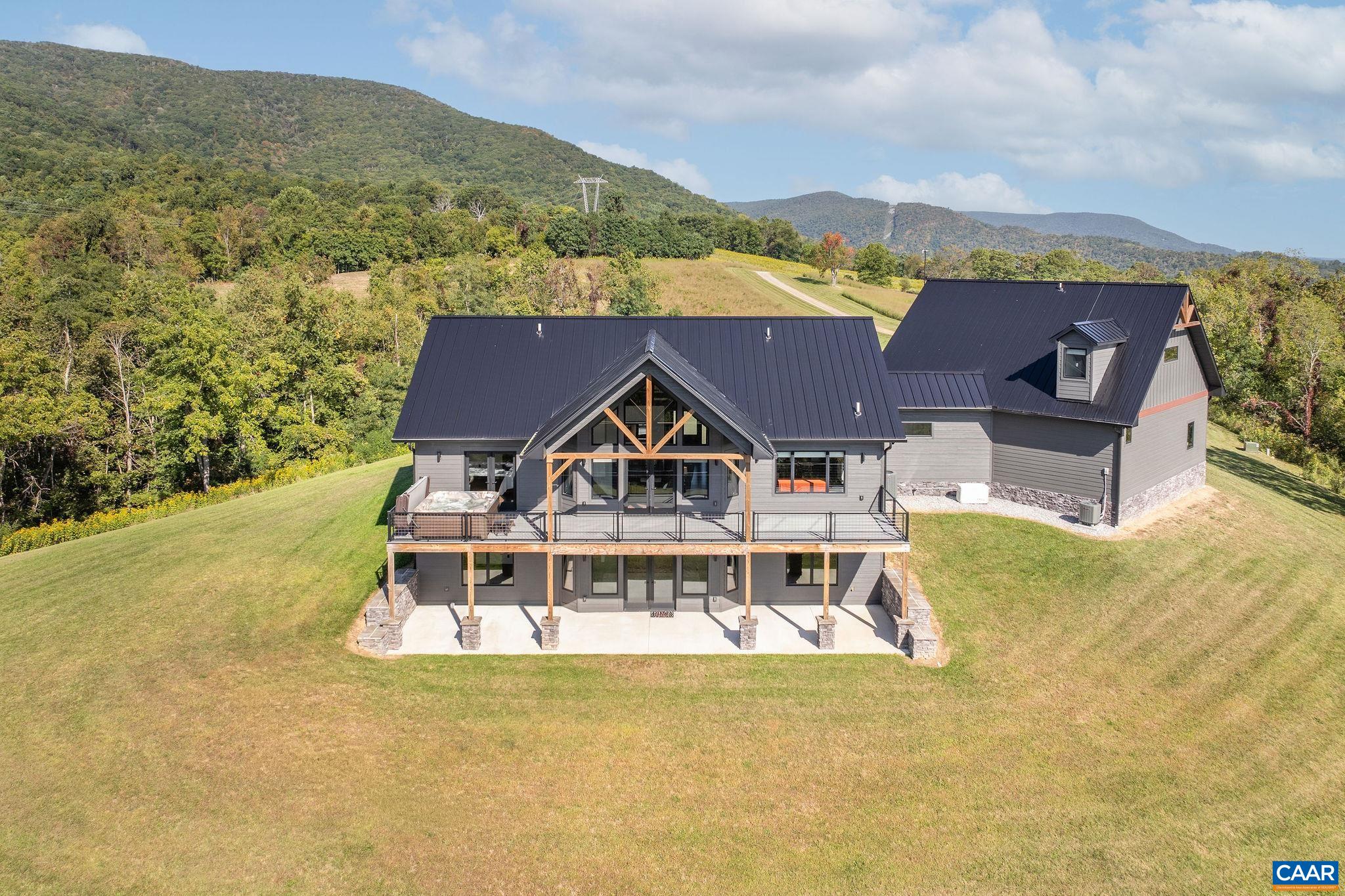 699 Hendrickson Road Pembroke, VA 24136 - Photo 11 of 69 an aerial view of a house with a big yard