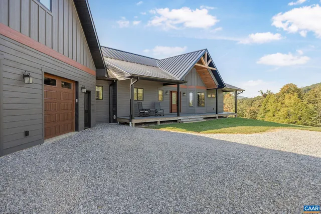 a dining room with wooden floor a glass table and chairs