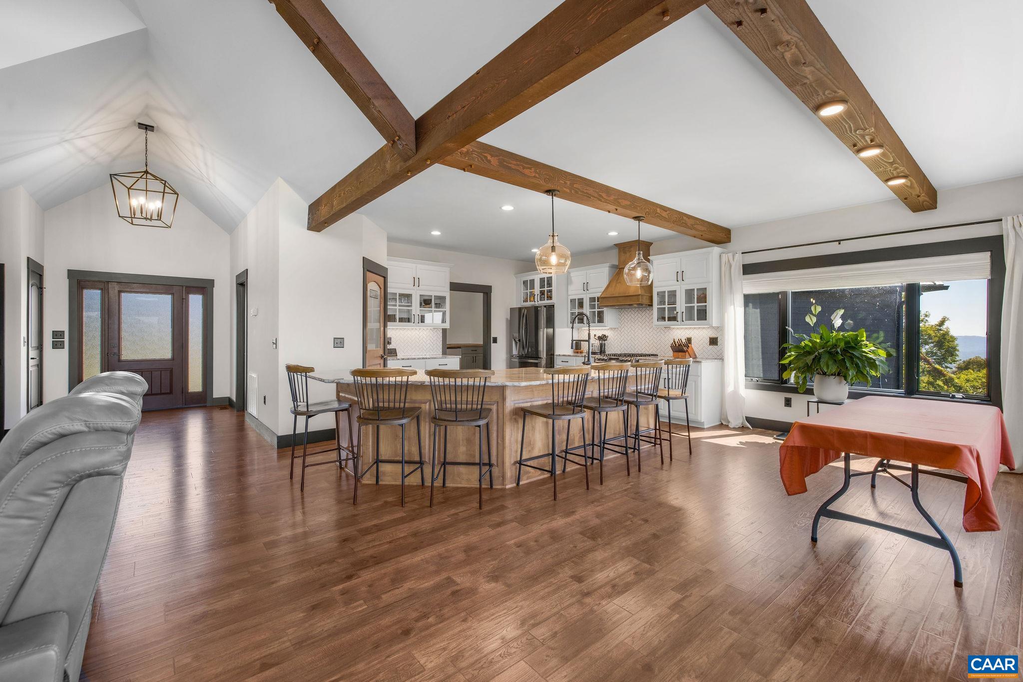 699 Hendrickson Road Pembroke, VA 24136 - Photo 17 of 69 a view of a dining room with furniture window and wooden floor