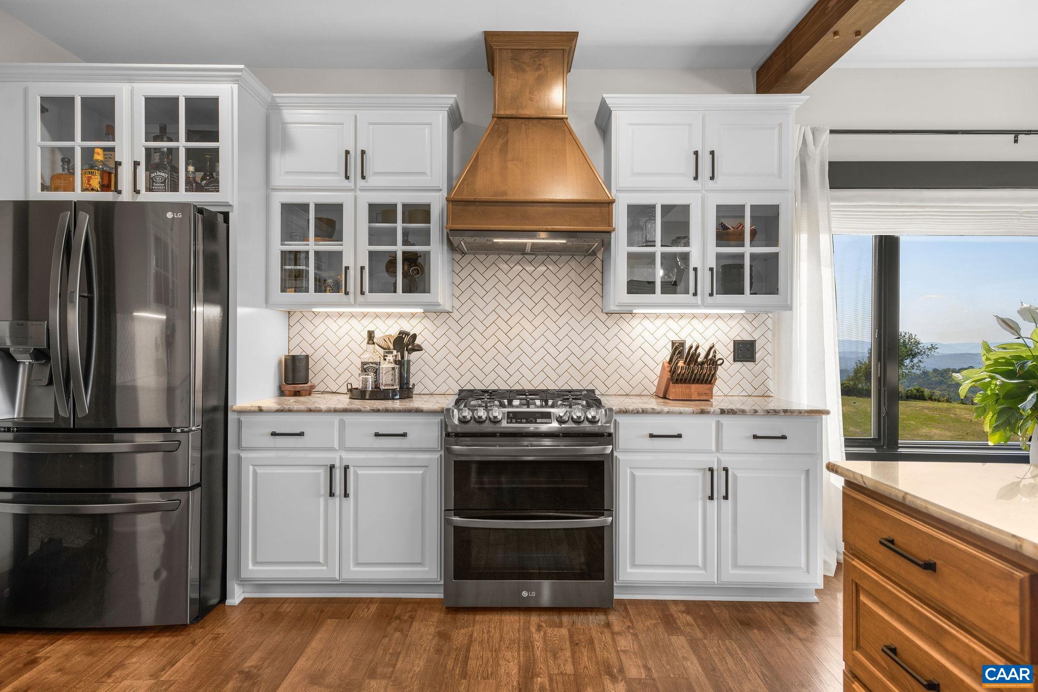 699 Hendrickson Road Pembroke, VA 24136 - Photo 21 of 69 a kitchen with stainless steel appliances granite countertop a stove and a refrigerator